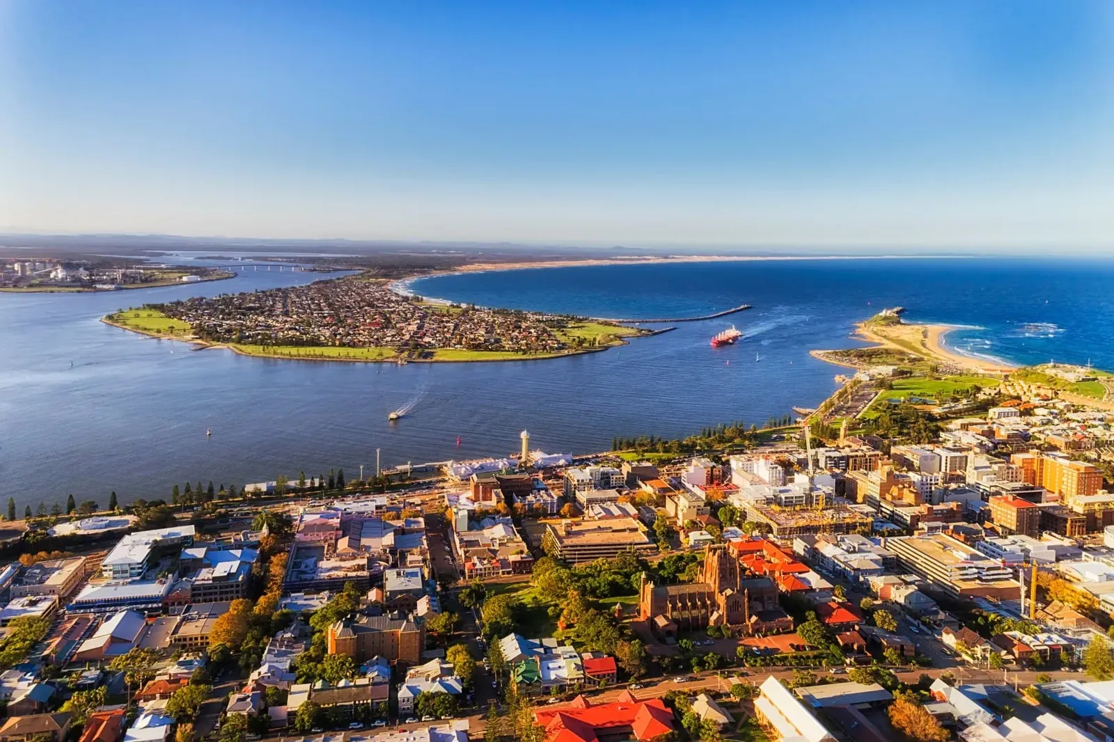 Aerial view of a coastal city, harbour and beaches